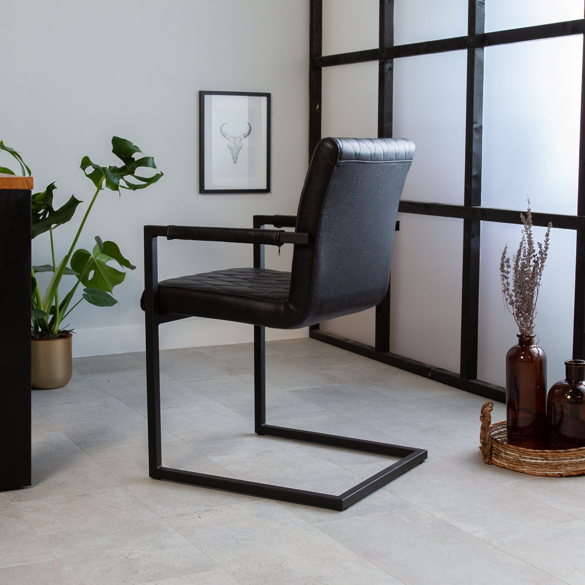 Dining room chair Ruben Dimehouse Black LxWxH 71x59x58 Faux leather Atmospheric photo diagonal rear view