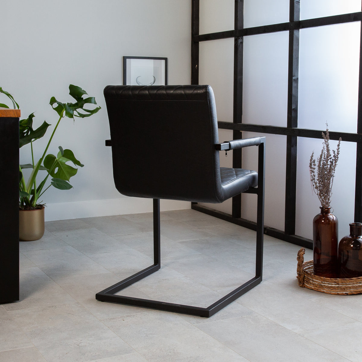 Dining room chair Ruben Dimehouse Black LxWxH 71x59x58 Faux leather Atmospheric photo diagonal rear view