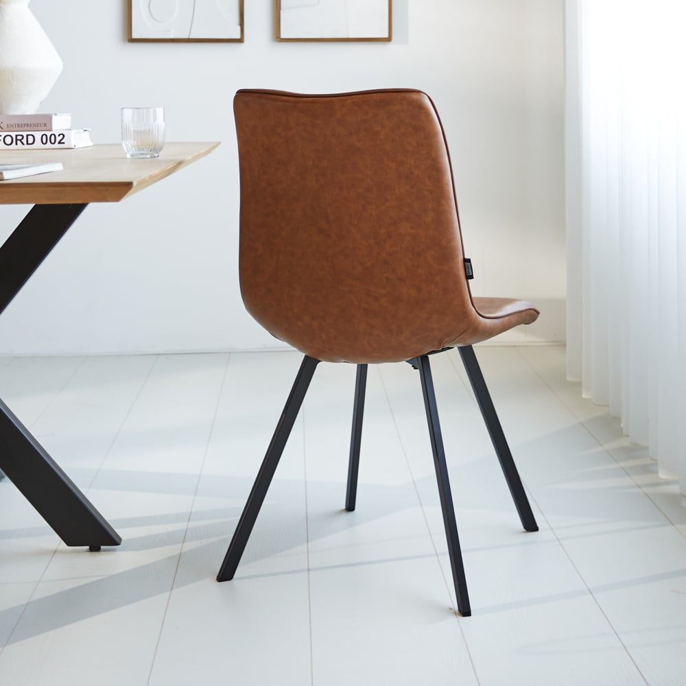 Dining room chair Jimmy Faux leather Dimehouse Cognac LxWxH 75x57x51 Faux leather Atmospheric photo diagonal rear view