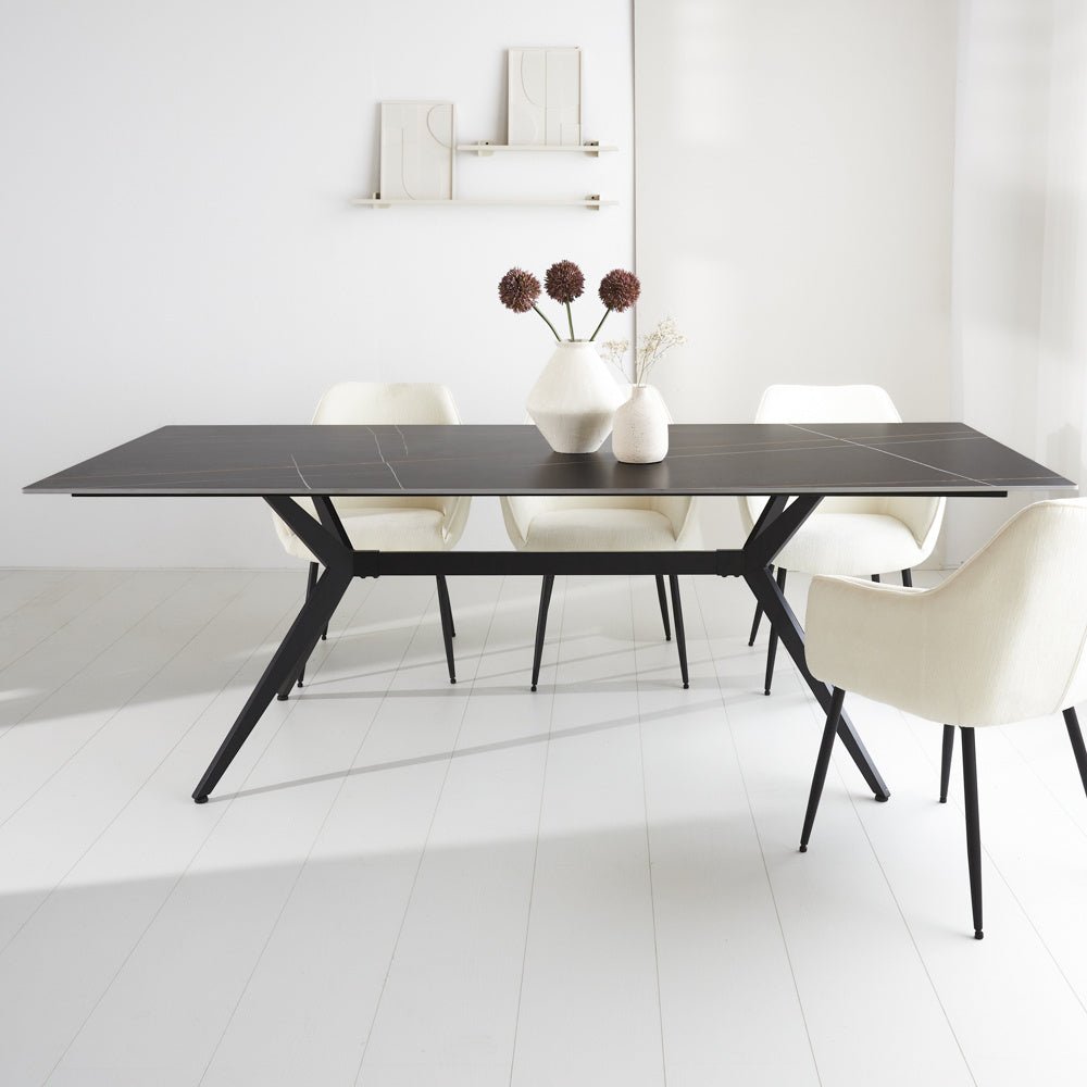 Dining table Grace Black Dimehouse Black Sintered stone Atmospheric photo diagonal front view