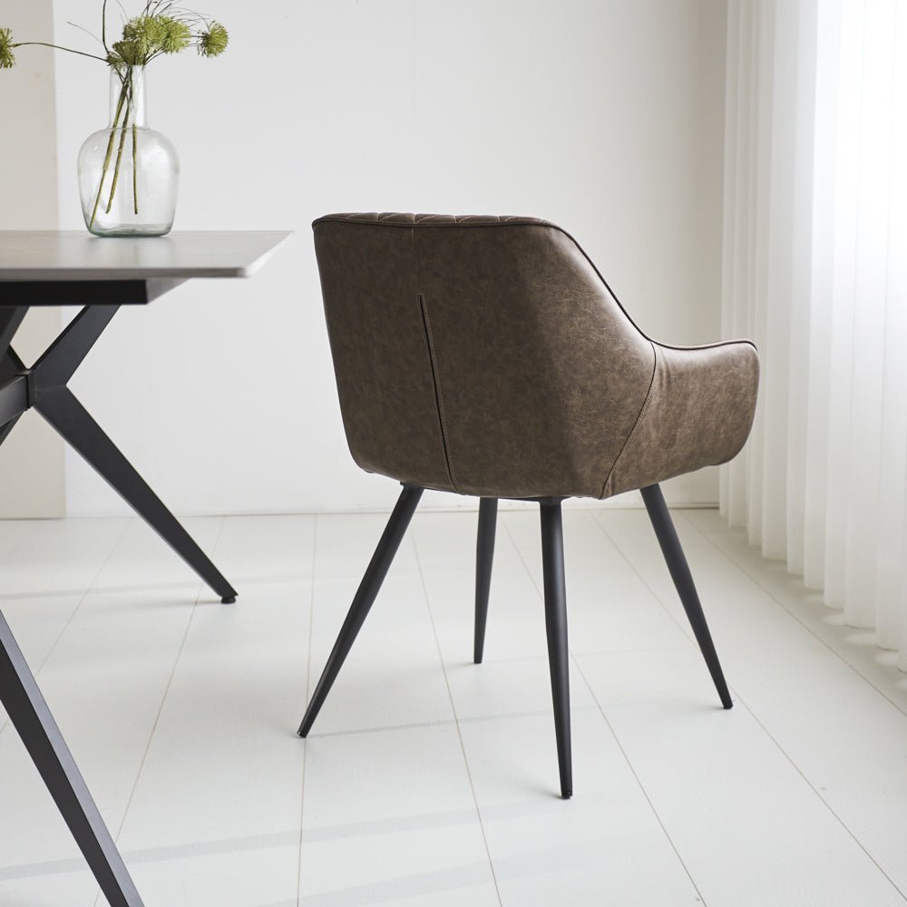 Dining room chair Cara Dimehouse Taupe LxWxH 78x65x57 Faux leather Atmospheric photo diagonal rear view
