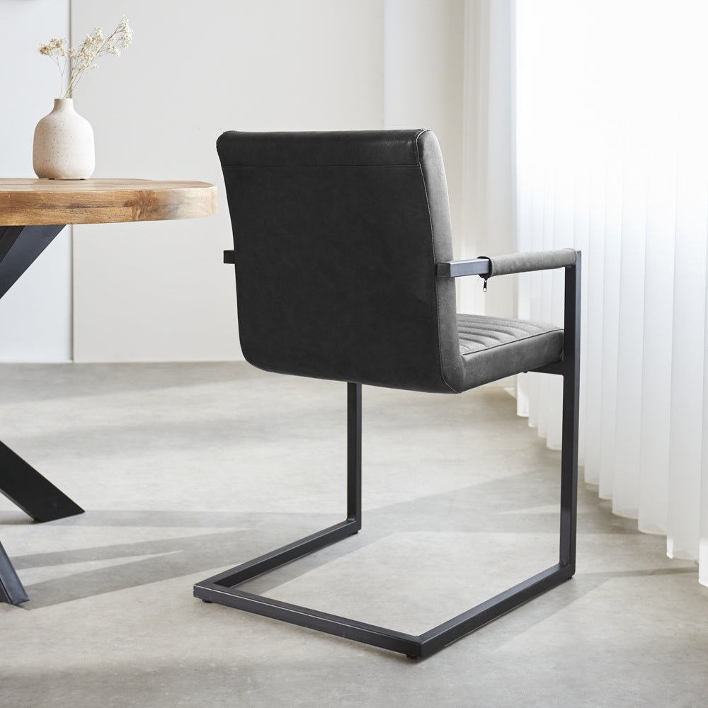 Dining room chair Kuba Dimehouse Anthracite LxWxH 71x59x58 Faux leather Atmospheric photo diagonal rear view