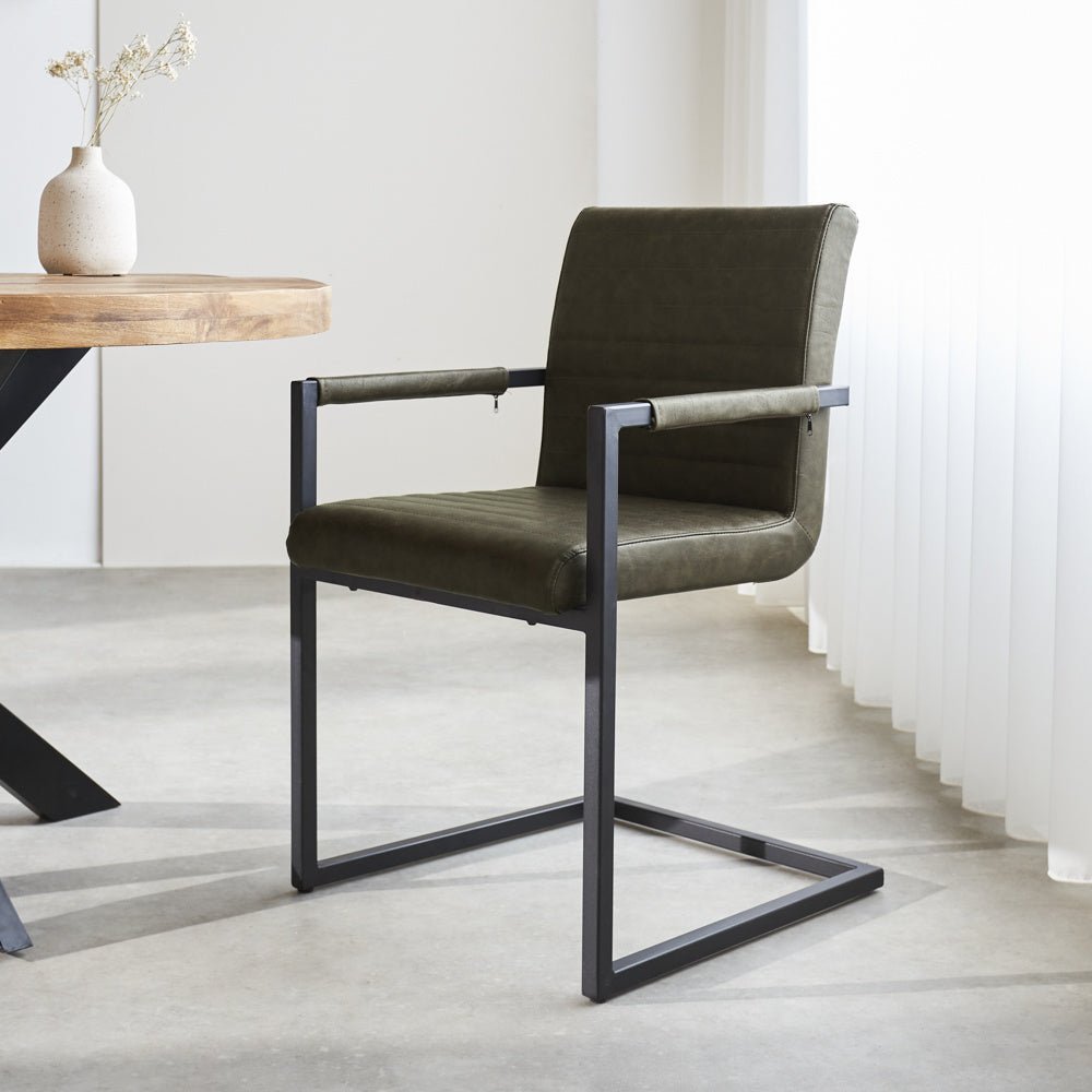Dining room chair Kuba Dimehouse Green LxWxH 71x59x58 Faux leather Atmospheric photo diagonal front view