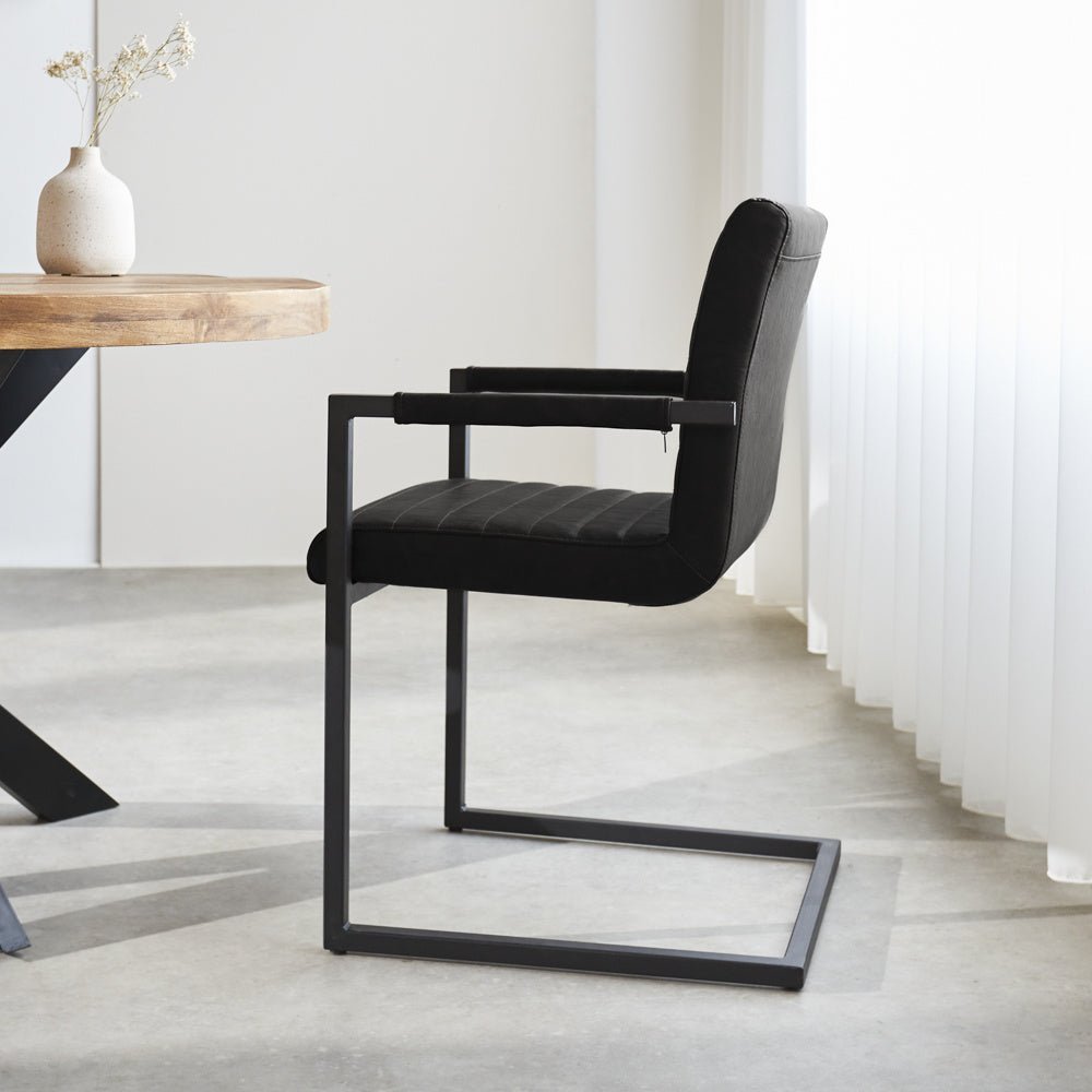 Dining room chair Kuba Dimehouse Black LxWxH 71x59x58 Faux leather Atmospheric photo side view