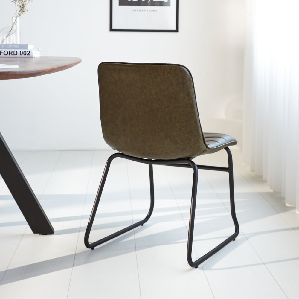 Dining room chair Mark Dimehouse Green LxWxH 74x56x54 Faux leather Atmospheric photo diagonal rear view