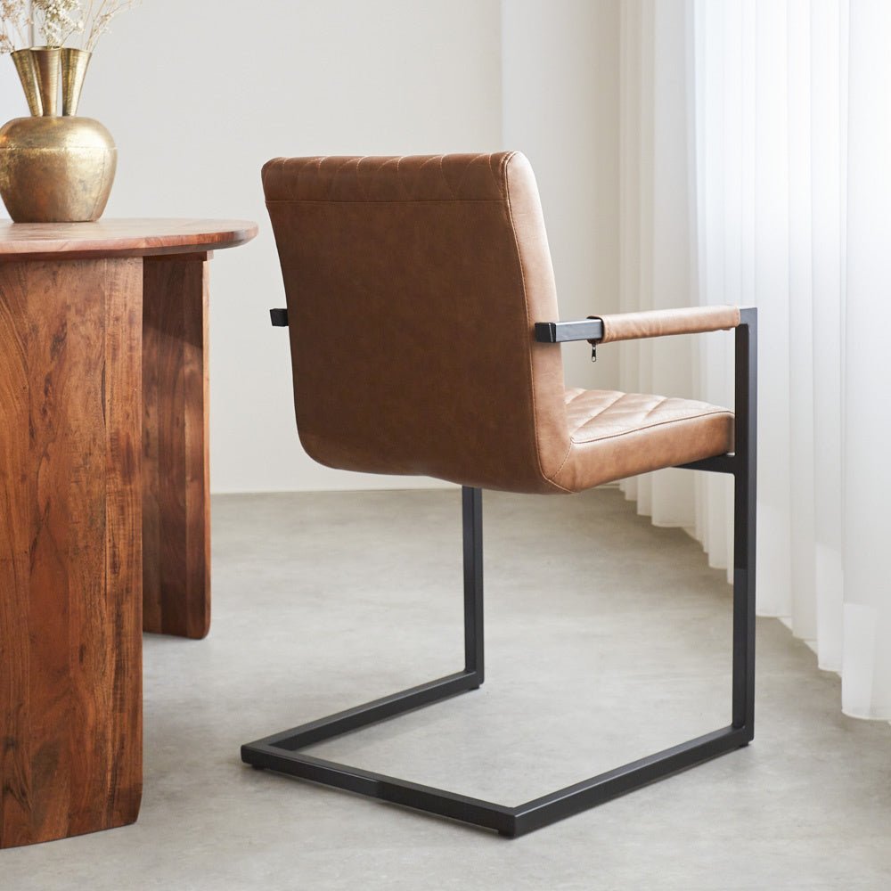Dining room chair Ruben Dimehouse Cognac LxWxH 71x59x58 Faux leather Atmospheric photo diagonal rear view