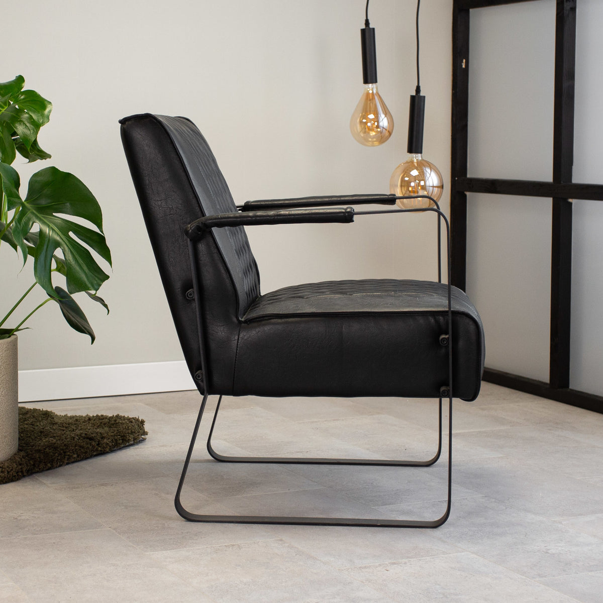 Armchair Peter Dimehouse Black LxWxH 68x63x45 Faux leather Atmospheric photo side view