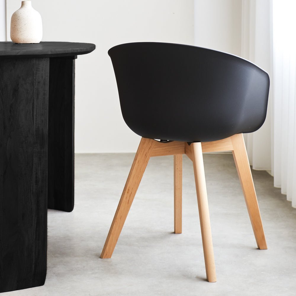 Herning dining room chair Dimehouse Black LxWxH 68x60x51 Plastic Atmospheric photo diagonal rear view