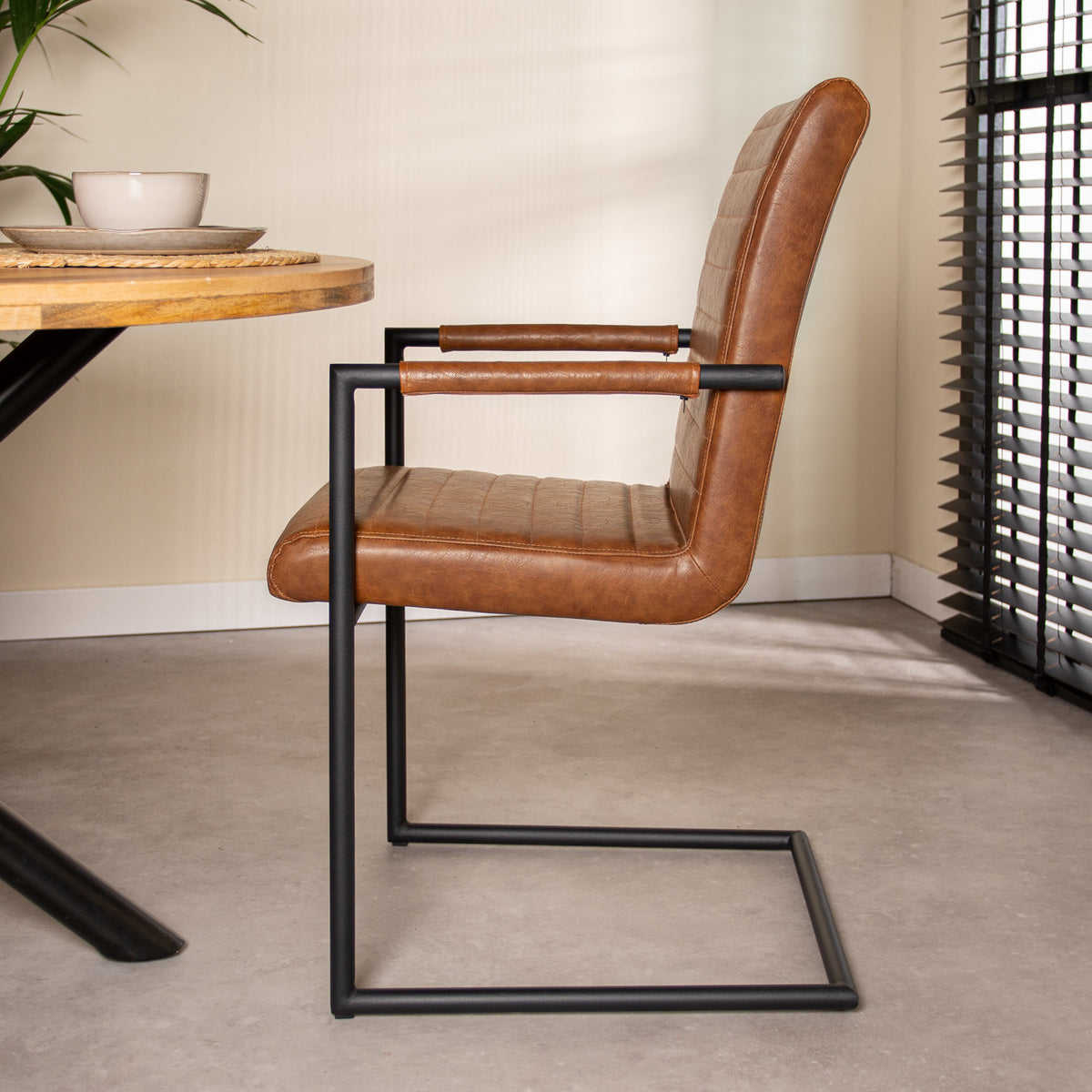 Dining room chair Bras Dimehouse Cognac LxWxH 73x59x58 Faux leather Atmospheric photo side view
