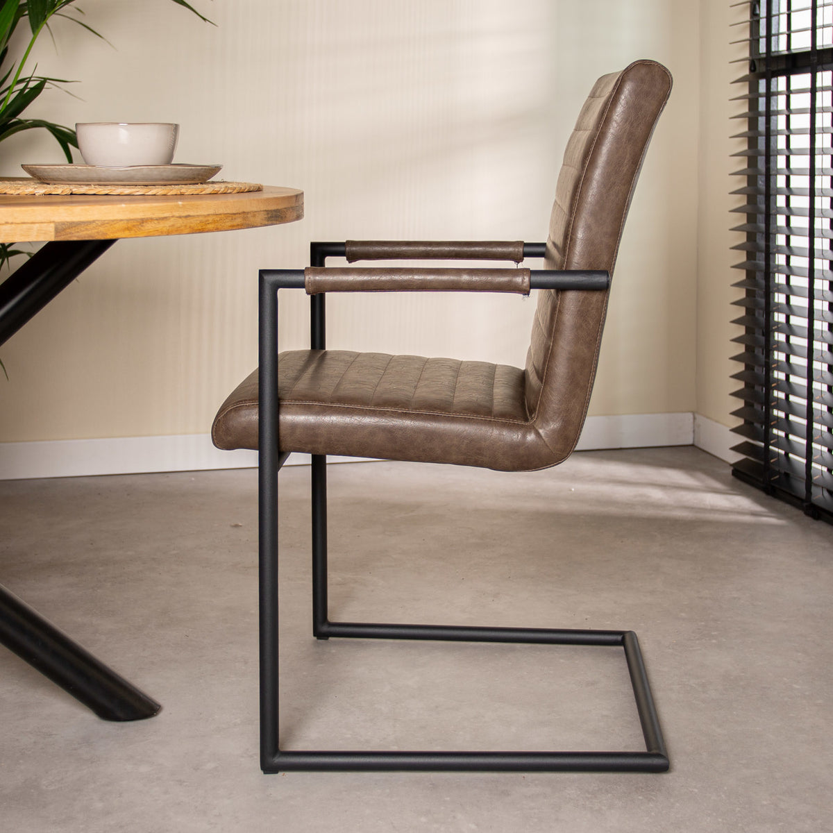 Dining room chair Bras Dimehouse Taupe LxWxH 73x59x58 Faux leather Atmospheric photo side view