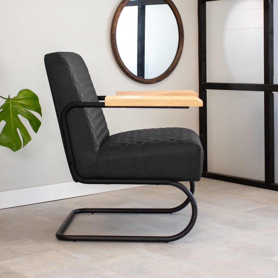 Armchair Lars Dimehouse Black LxWxH 68x64x39 Faux leather Atmospheric photo side view