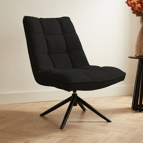 Swivel armchair Yuki Black Bouclé 360° Rotatable atmospheric photo in a modern interior