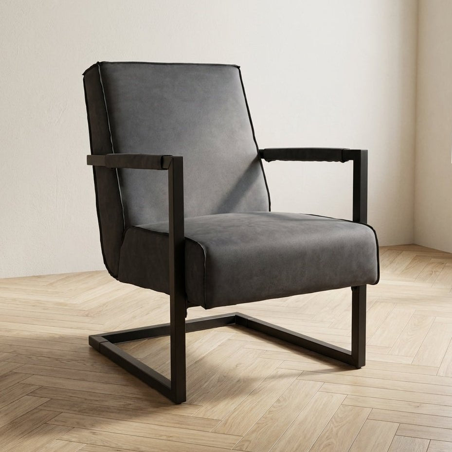 Industrial leather armchair anthracite Tiger atmospheric photo in a modern interior