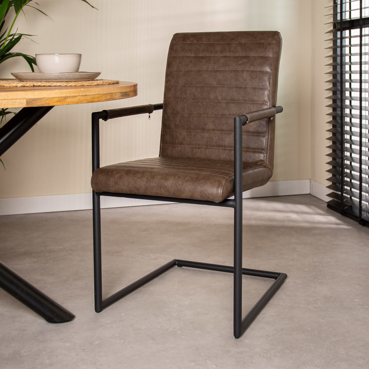 Dining room chair Bras Dimehouse Taupe LxWxH 73x59x58 Faux leather Atmospheric photo diagonal front view