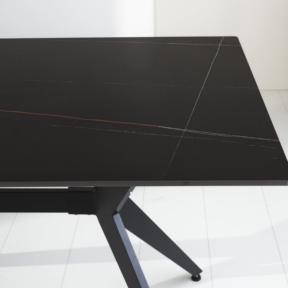 Dining table Grace Black Dimehouse Black LxWxH 160x94x13 Sintered stone Atmospheric photo diagonal front view