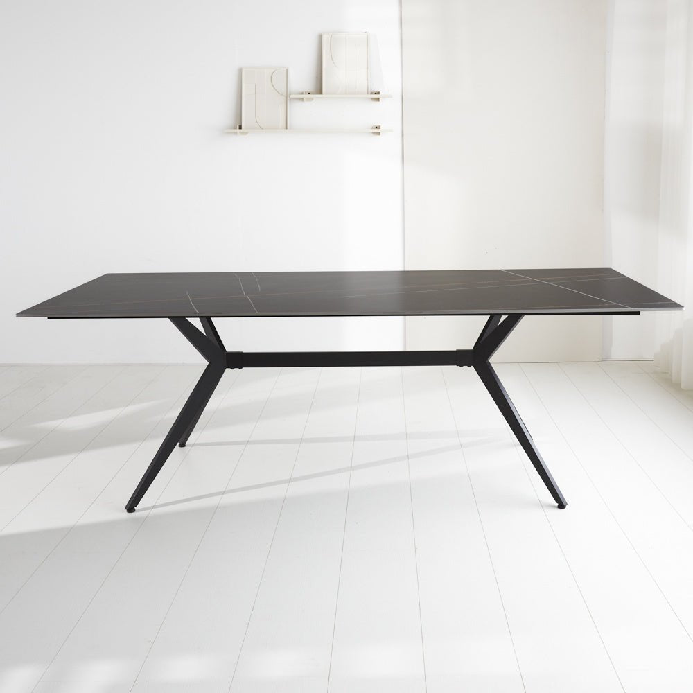 Dining table Grace Black Dimehouse Black Sintered stone Atmospheric photo diagonal front view