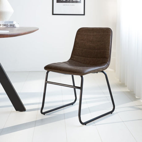 Dining room chair Mark Dimehouse Taupe LxWxH 74x56x54 Faux leather Atmospheric photo diagonal front view