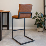 Barstool Kuba Dimehouse Cognac LxWxH 72x69x54 Faux leather Atmospheric photo diagonal rear view