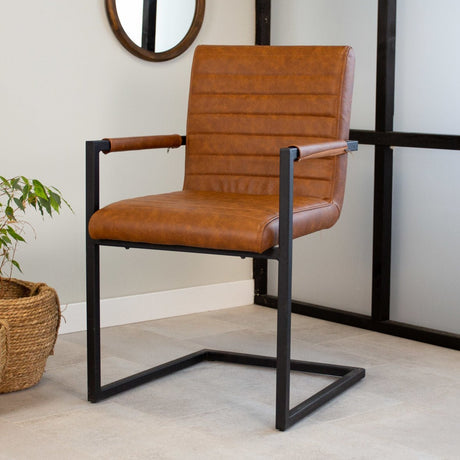 Dining room chair Kuba Dimehouse Cognac LxWxH 71x59x58 Faux leather Atmospheric photo diagonal front view