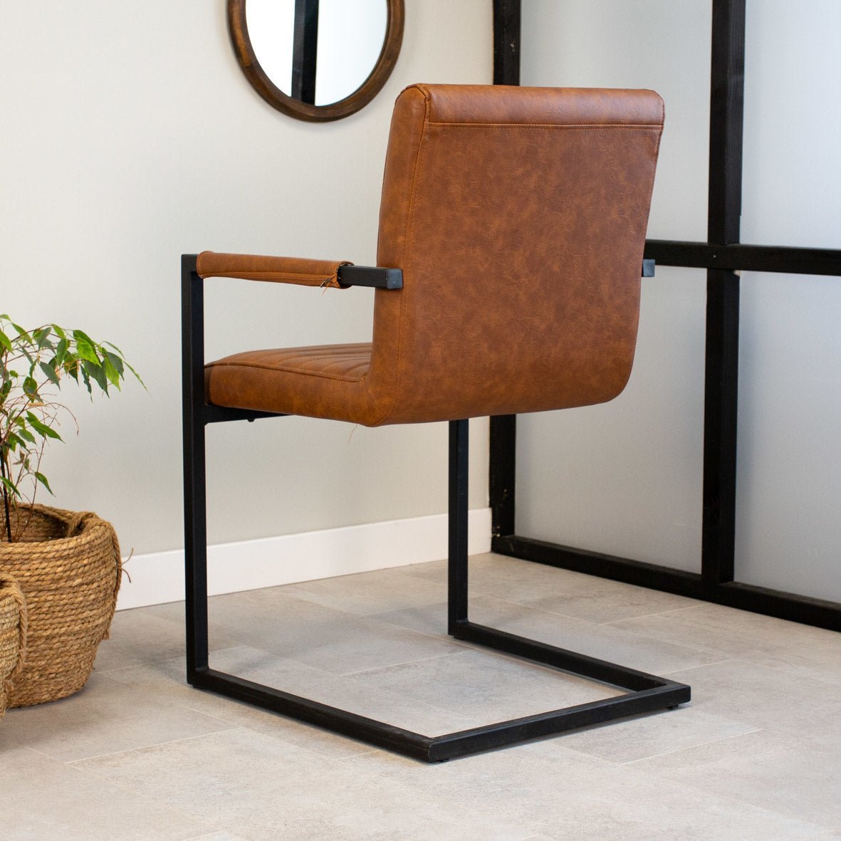 Dining room chair Kuba Dimehouse Cognac LxWxH 71x59x58 Faux leather Atmospheric photo diagonal rear view
