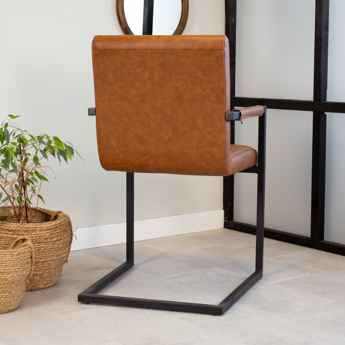 Dining room chair Kuba Dimehouse Cognac LxWxH 71x59x58 Faux leather Atmospheric photo diagonal rear view