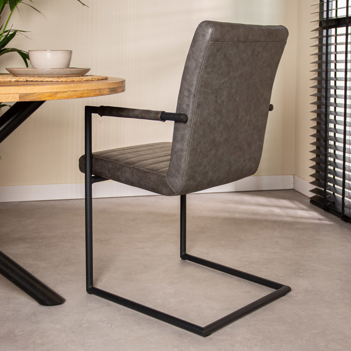 Dining room chair Bras Dimehouse Anthracite LxWxH 73x59x58 Faux leather Atmospheric photo diagonal rear view