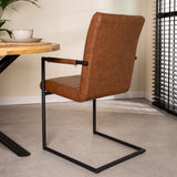 Dining room chair Bras Dimehouse Cognac LxWxH 73x59x58 Faux leather Atmospheric photo diagonal rear view