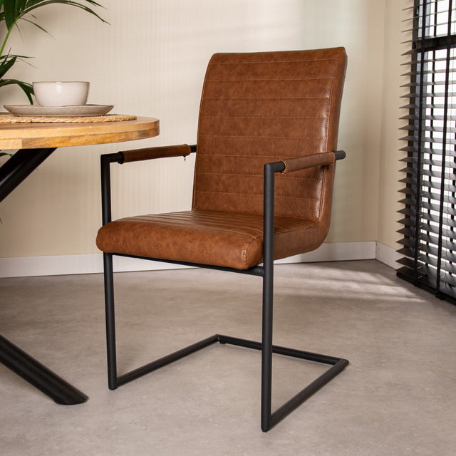 Dining room chair Bras Dimehouse Cognac LxWxH 73x59x58 Faux leather Atmospheric photo diagonal front view