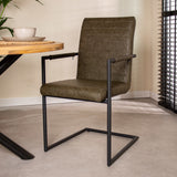 Dining room chair Bras Dimehouse Green LxWxH 73x59x58 Faux leather Atmospheric photo diagonal front view