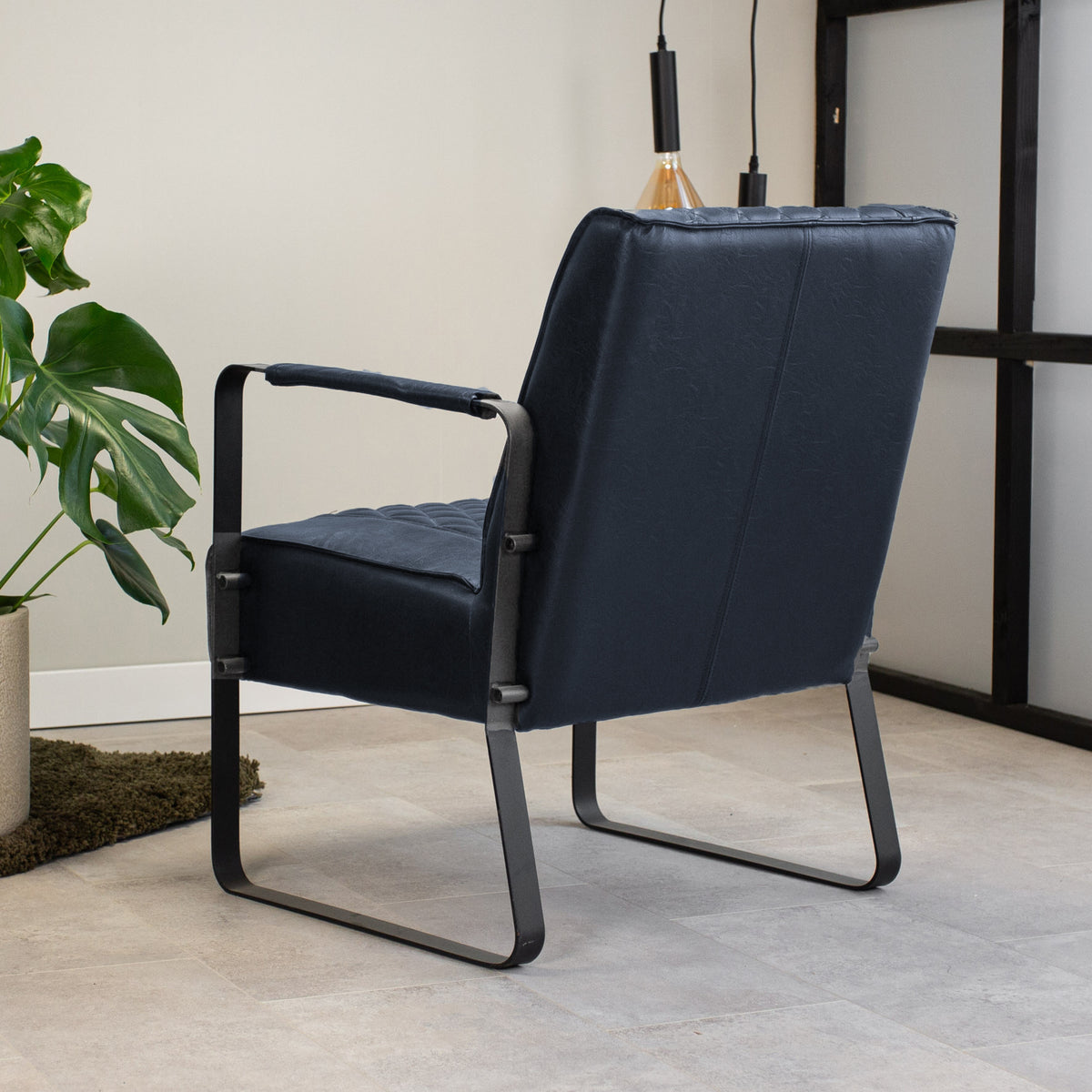 Armchair Peter Dimehouse Blue LxWxH 68x62x45 Faux leather Atmospheric photo diagonal rear view
